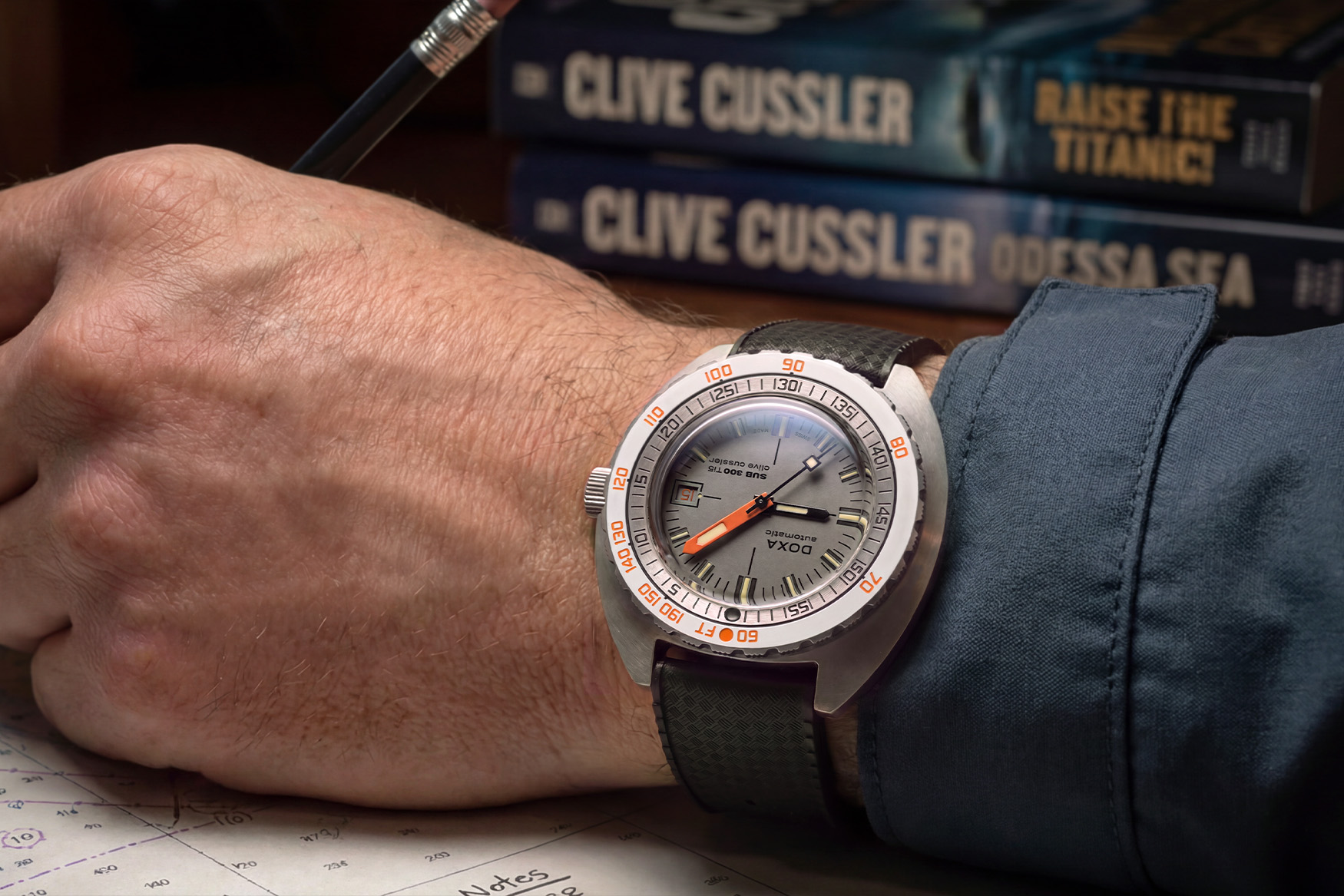 Doxa SUB 300 Ti5 Clive Cussler on the wrist on the black Dive Flex tropic-style rubber strap