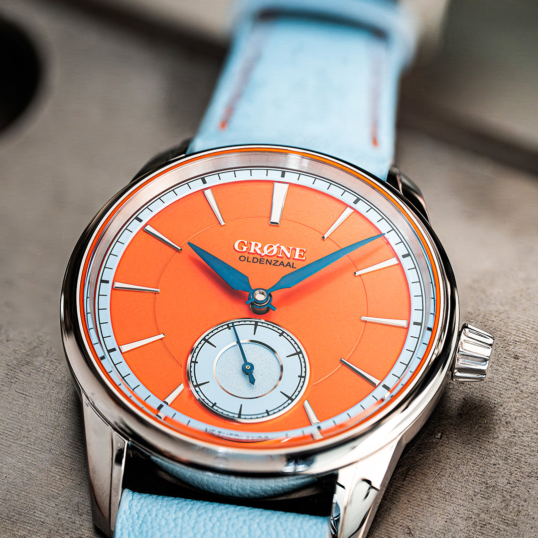 GRØNE Horologium Something Quirky variant with Dutch orange and baby blue dial elements and heat-blued hands