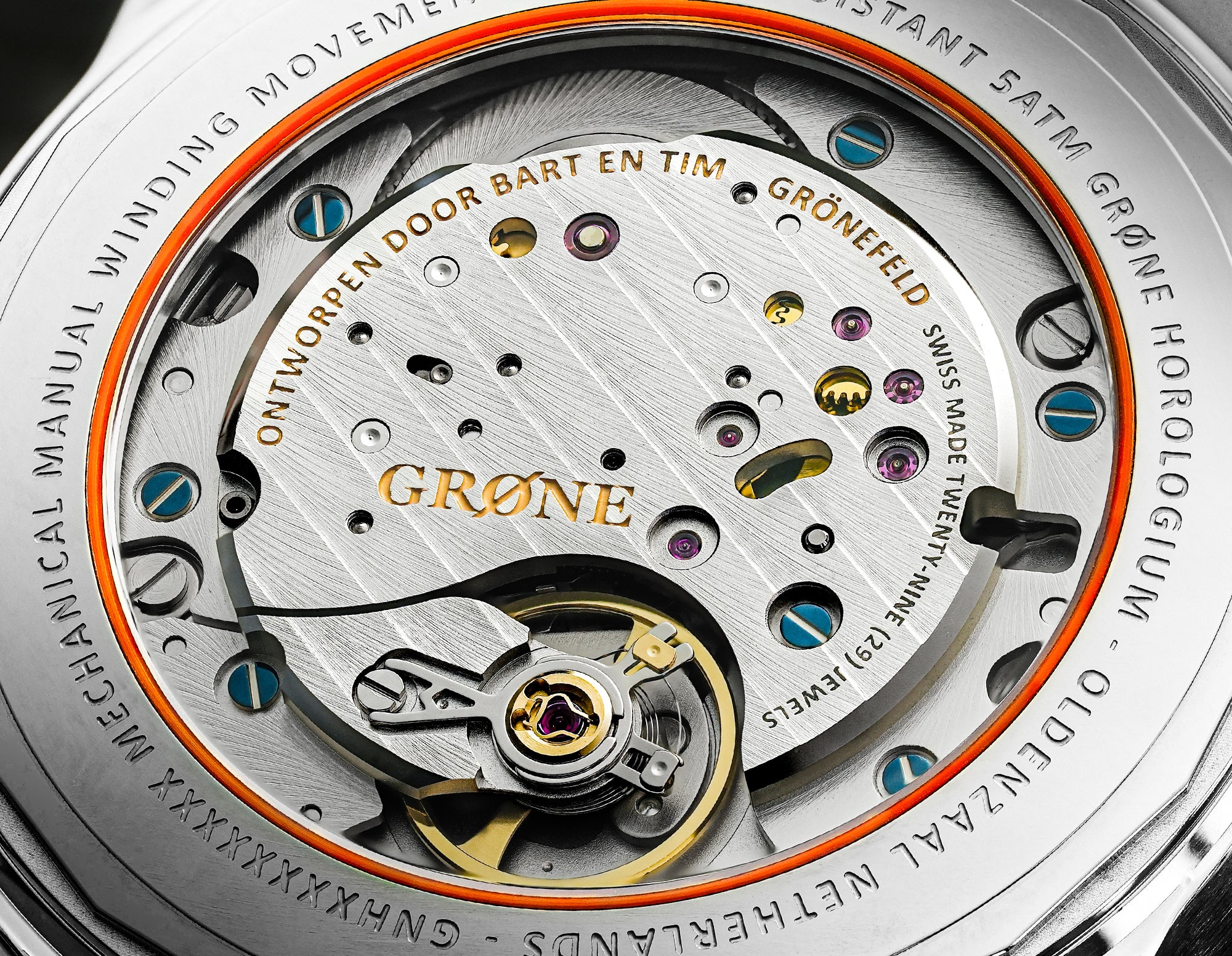 Close-up of GRØNE Horologium movement finishing detail showing polished anglage and heat-blued screws